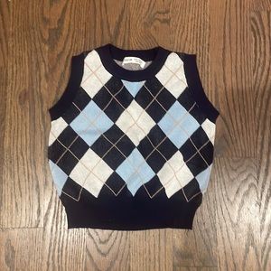 A cute sweater vest from SHEIN, which comes in the size Kids; Girls, 12.